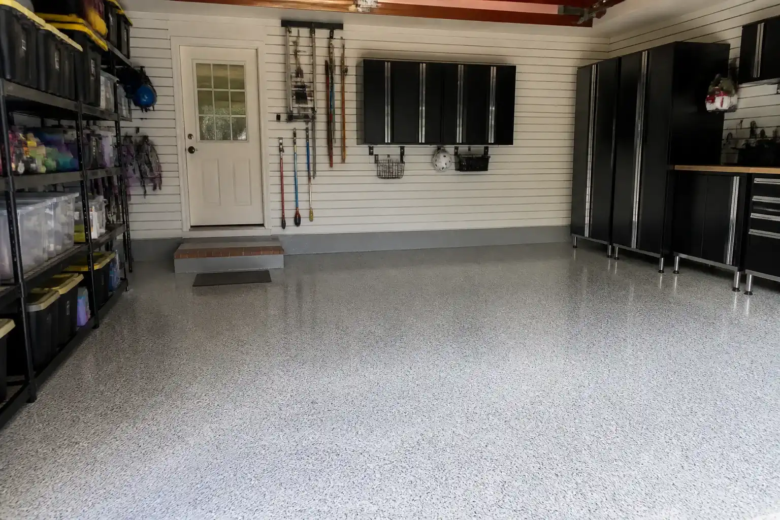 Coated garage floor in Dunwoody GA with storage cabinets