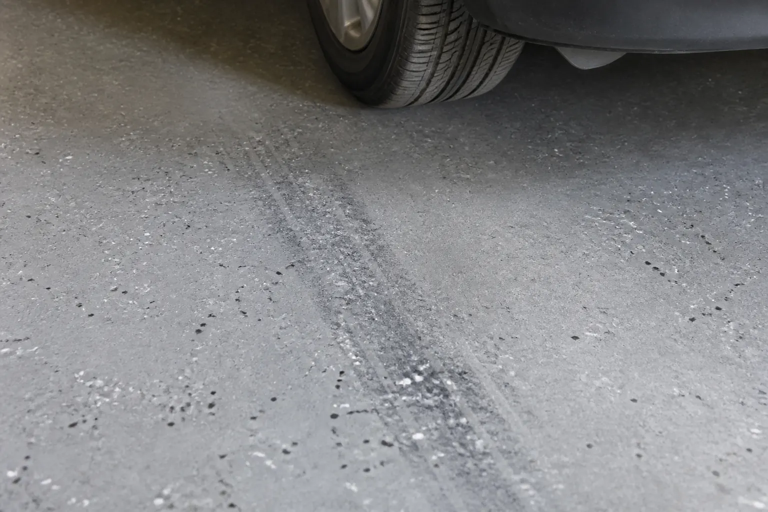 Car parked on a durable coated garage floor