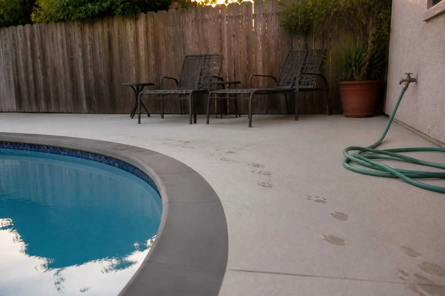 Coated concrete pool deck